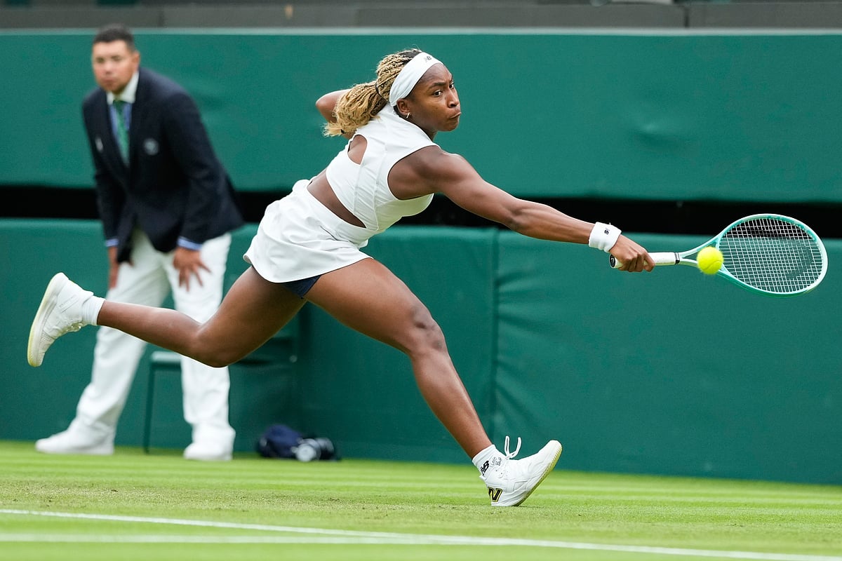 (AP Photo/Mosa'ab Elshamy, File) : FILE - Coco Gauff, of the United States, plays a backhand return to Anca Todoni, of Romania, during their match on Day 3 at the Wimbledon tennis championships in London, July 3, 2024. For the first time in more than 30 years, the tennis competition at an Olympics will be held on red clay, which means players who just made the adjustment from that surface at the French Open in early June to grass at Wimbledon in early July now will need to reverse course again in short order. 


